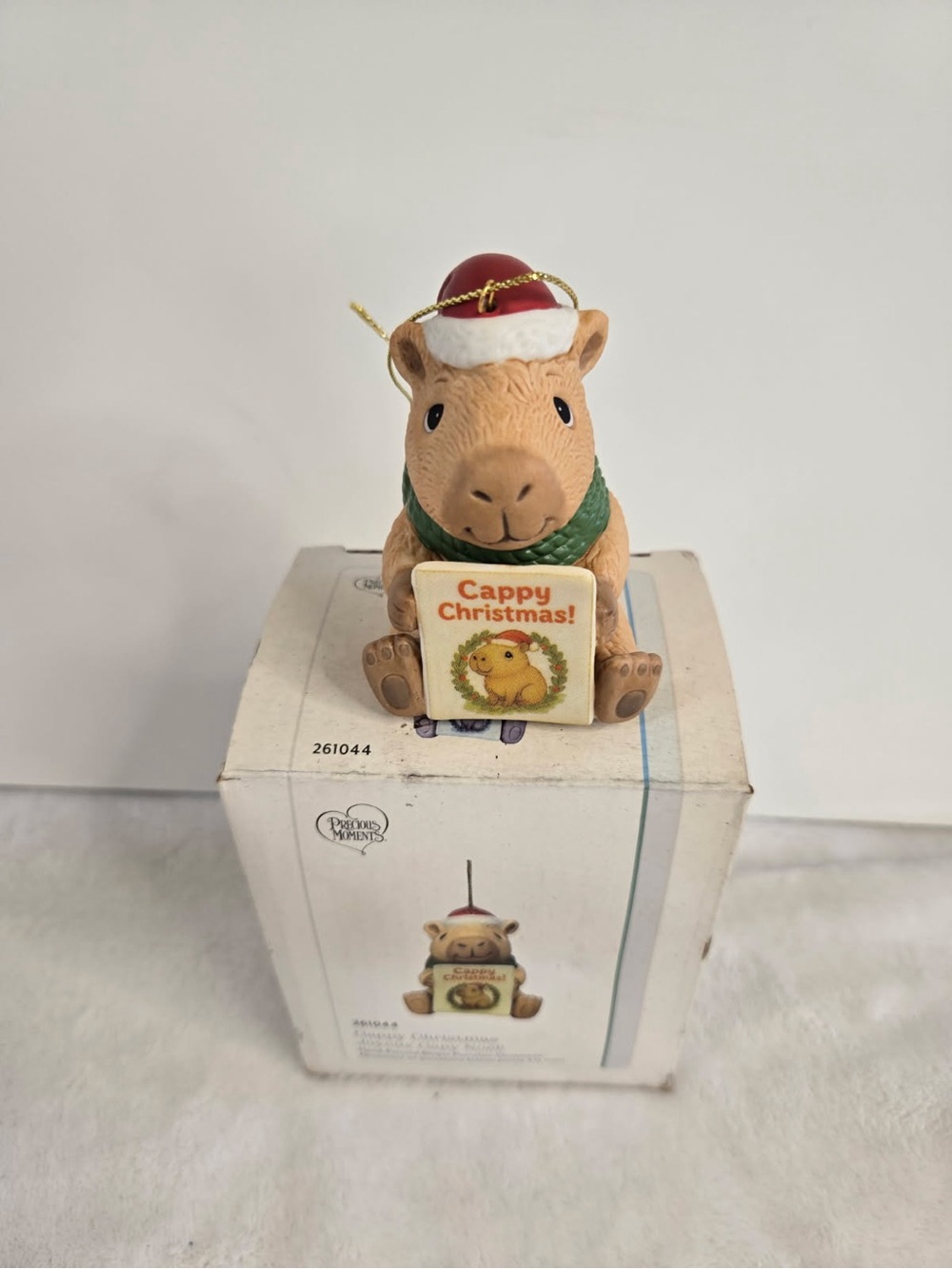 Precious Moments Tan Capybara with Red Santa Hat and Green Scarf Ornament